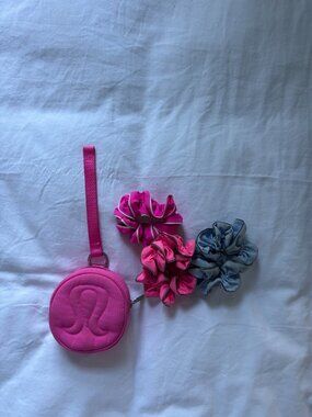 Lululemon Logo Pouch with 3 lululemon scrunchies.